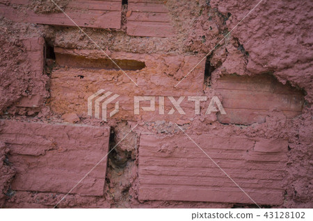 Dark orange colored brick wall. Clayish material Dark orange colored brick wall. Clayish material 43128102