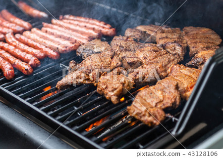 Barbecue grill bbq on propane gas grill steaks bratwurst sausages meat meal 43128106