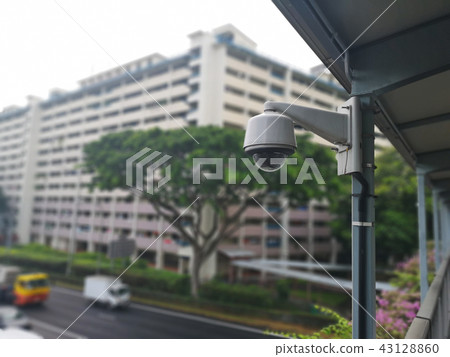 A surveillance camera is installed on a bridge. A surveillance camera is installed on a bridge. 43128860