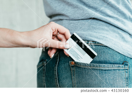 bank fraud credit card theft hand stealing pocket 43130160
