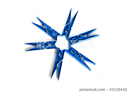Blue clothespins stacked in a circle on a white background 43130438