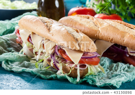 Submarine sandwiches with ham and cheese Submarine sandwiches with ham and cheese 43130898