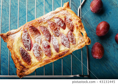 Homemade puff pastry flan with plums Homemade puff pastry flan with plums 43131445