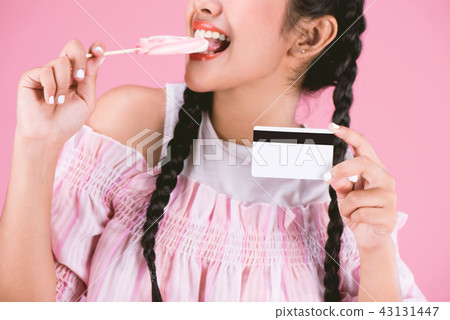 Easy Business,woman showing credit card and candy 43131447