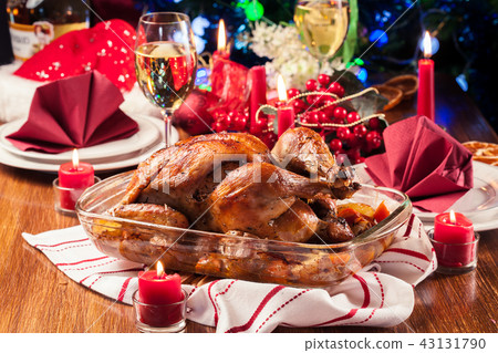 Baked or roasted whole chicken on Christmas table 43131790