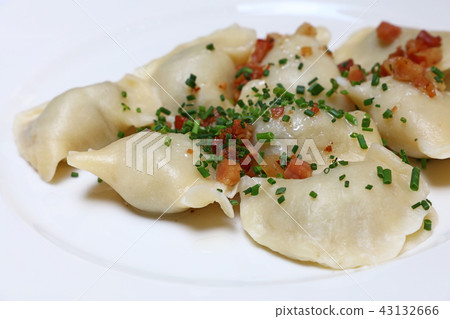 Dumplings with bacon and green chives close up 43132666