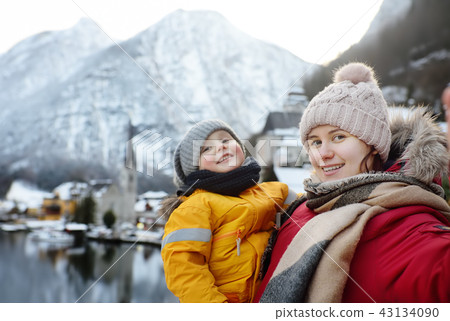 Young woman and her son making selfie  43134090