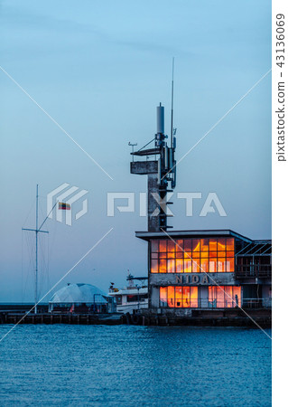 Reflection of the sun on the port glass in Nida, Lithuania. 43136069