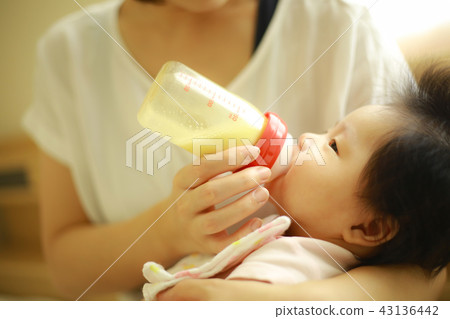 Baby drinking milk Baby drinking milk 43136442