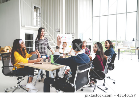 Group of multiracial young creative team talking 43140157