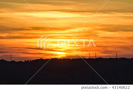 Sunset in a cloudy day above vineyard 43140622