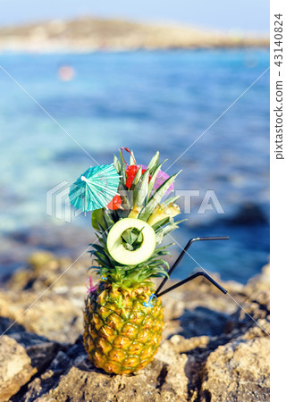 Pineapple decorated in a great exotic style Pineapple decorated in a great exotic style 43140824