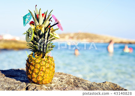 Pineapple decorated in a great exotic style Pineapple decorated in a great exotic style 43140828