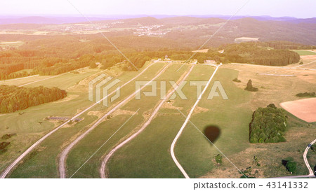 shadow of hot air balloon on the field shadow of hot air balloon on the field 43141332
