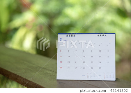Desktop Calendar page 2018 place on a wooden desk  43141802
