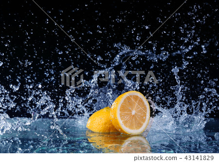 Sliced lemon in the water on black background Sliced lemon in the water on black background 43141829