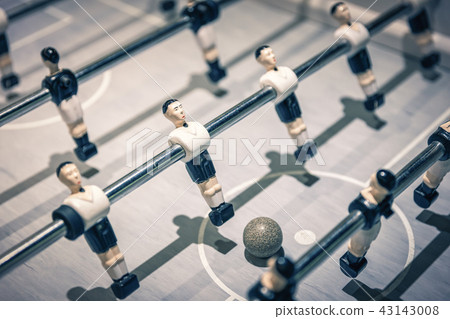 Table football players rotating to kick ball Table football players rotating to kick ball 43143008