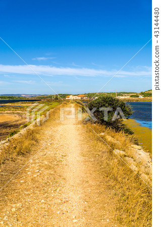 Stony path along the saline at town of Gruissan 43144480