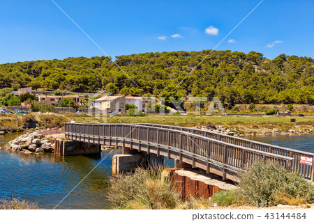 Wooden bridge over a water by villlage Gruissan Wooden bridge over a water by villlage Gruissan 43144484