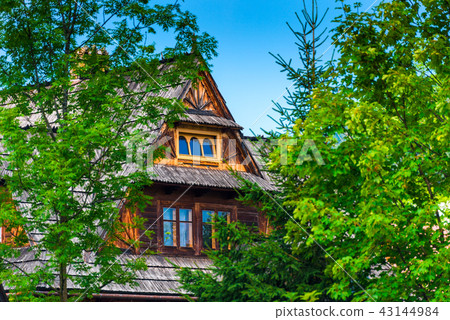 wooden house among the trees on a sunny day wooden house among the trees on a sunny day 43144984