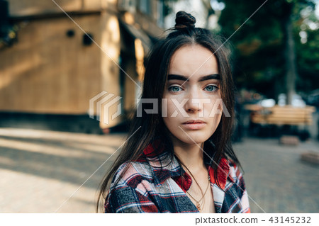 Close-up portrait of beautiful calm young woman Close-up portrait of beautiful calm young woman 43145232