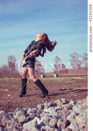 girl with guitar in leather jacket girl with guitar in leather jacket 43145304