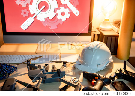 Drone maintenance with spare parts on the table Drone maintenance with spare parts on the table 43150063