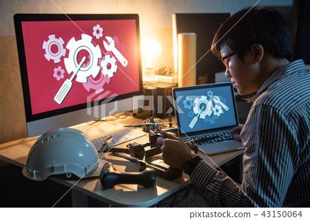 Technical engineer repairing drone using laptop Technical engineer repairing drone using laptop 43150064