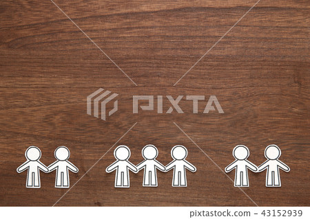 Teamwork silhouettes of people holding hands Teamwork silhouettes of people holding hands 43152939