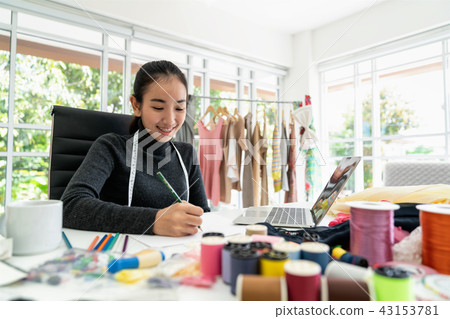 Happy asian smart looking fashion designer Happy asian smart looking fashion designer 43153781