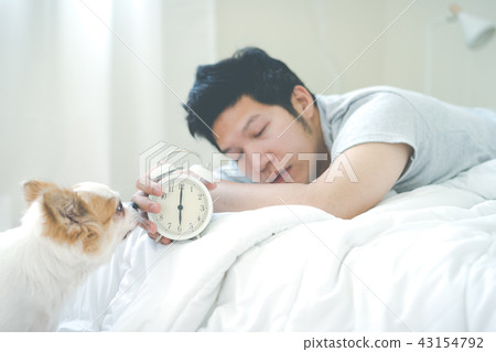Sleepy young asian man wake up early in morning 43154792