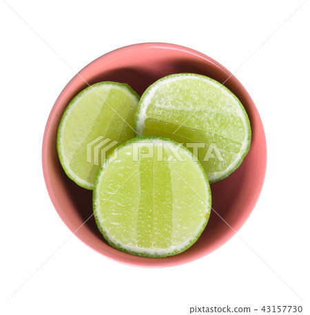 Lime fruit in bowl on white background. Lime fruit in bowl on white background. 43157730