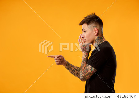The young man whispering a secret behind her hand The young man whispering a secret behind her hand 43166467