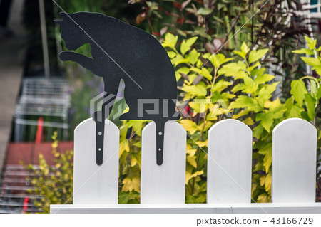 decorative cat on the fence. decorations for garden 43166729