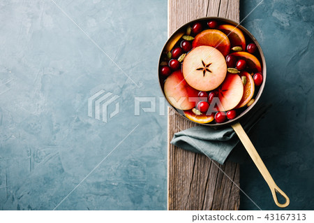 Mulled wine with fruits in saucepan Mulled wine with fruits in saucepan 43167313