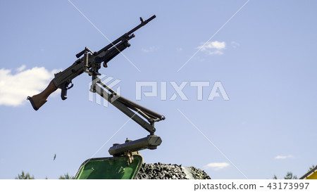 machine gun mounted on military vehicle 43173997