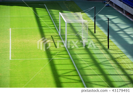 Scenery of a soccer stadium with beautiful green natural grass Scenery of a soccer stadium with beautiful green natural grass 43179491
