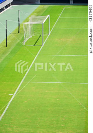 Scenery of a soccer stadium with beautiful green natural grass Scenery of a soccer stadium with beautiful green natural grass 43179492