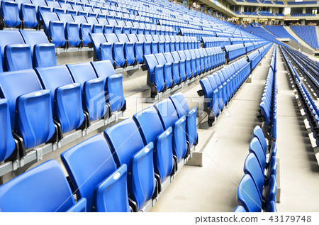 blue seats in football stadium 43179748
