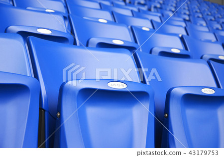 blue seats in football stadium 43179753