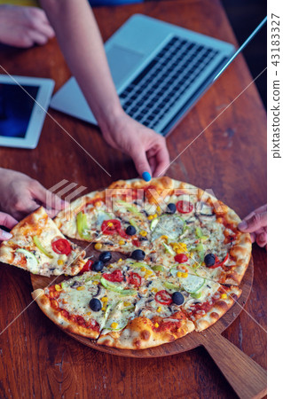 Mock up freelancer workplace. Tablet PC, cell phone and pizza. Top view image. Fast pizza delivery Mock up freelancer workplace. Tablet PC, cell phone and pizza. Top view image. Fast pizza delivery 43183327