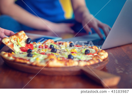 Mock up freelancer workplace. Tablet PC, cell phone and pizza. Top view image. Fast pizza delivery Mock up freelancer workplace. Tablet PC, cell phone and pizza. Top view image. Fast pizza delivery 43183987