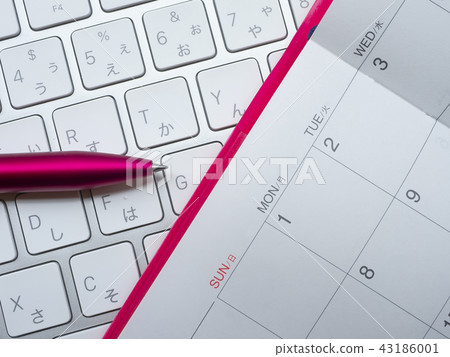 Business image · calendar · keyboard · notebook · woman 43186001