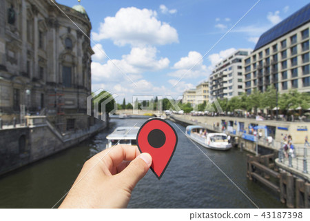 man with a red marker at Spree river in Berlin 43187398