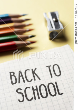 pencil crayons, sharpener and text back to school 43187407