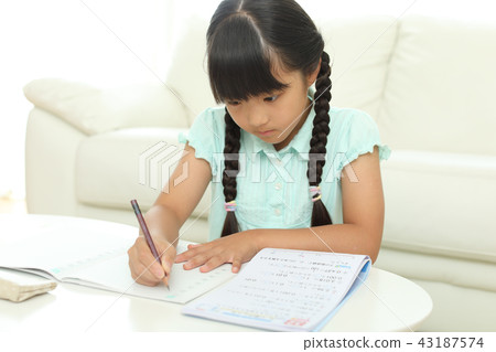 Girls doing their homework 43187574