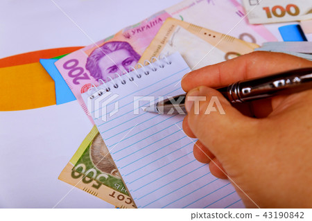 Top view, working table with financial notebook Top view, working table with financial notebook 43190842
