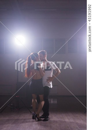Active happy adults dancing bachata together in dance class 43191992