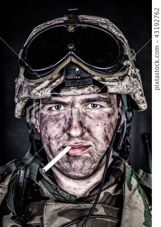 Marine in helmet with dirty face after firefight Marine in helmet with dirty face after firefight 43192762