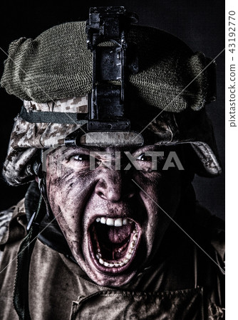 Mad army soldier screaming while looking at camera 43192770